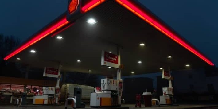 red and white store front during night time